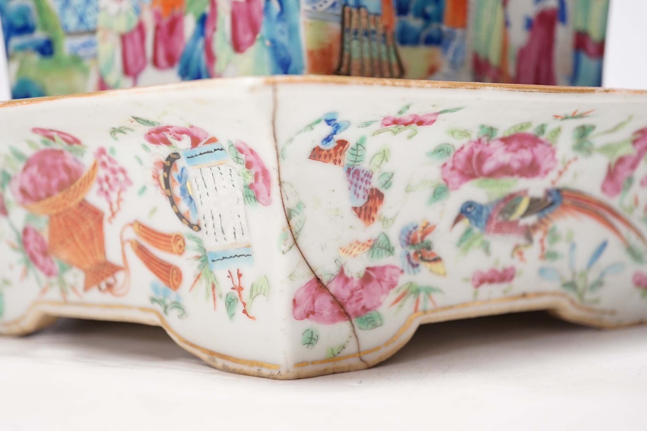 A 19th Chinese Canton decorated famille rose hexagonal planter, with stand, the stand cracked, 19.5cm total. Condition - fair